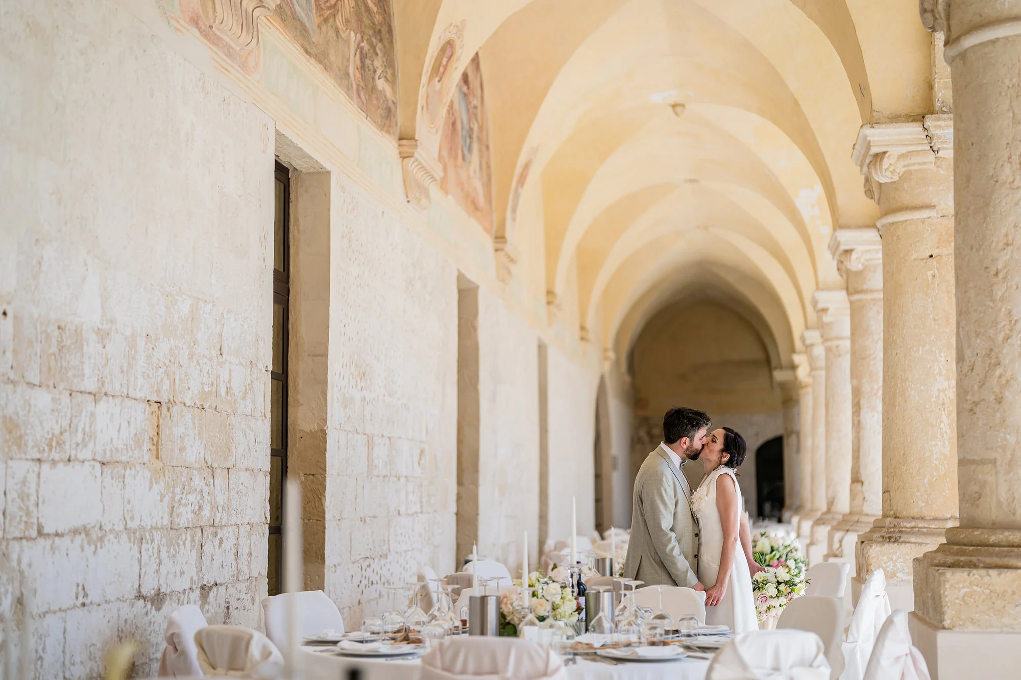 Home Page Simone Goglia 13 Bride and groom kissing in the Chiostro dei Domenicani cloister in Lecce