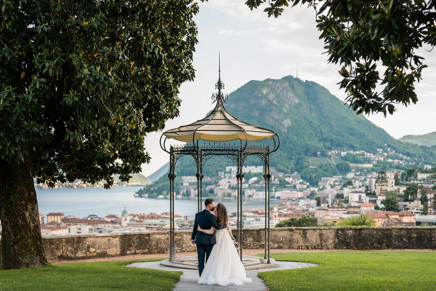 Reviews 7 The couple kiss under a gazebo overlooking Lake Lugano