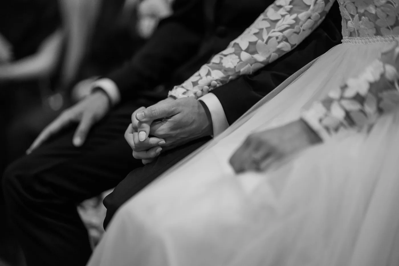 Reviews 4 Couple holding hands during the wedding ceremony